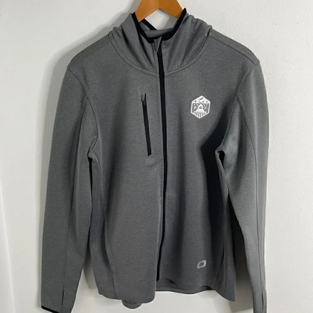 OGIO athletic zip up jacket.  Size Medium. Blue Pac embroidered emblem.